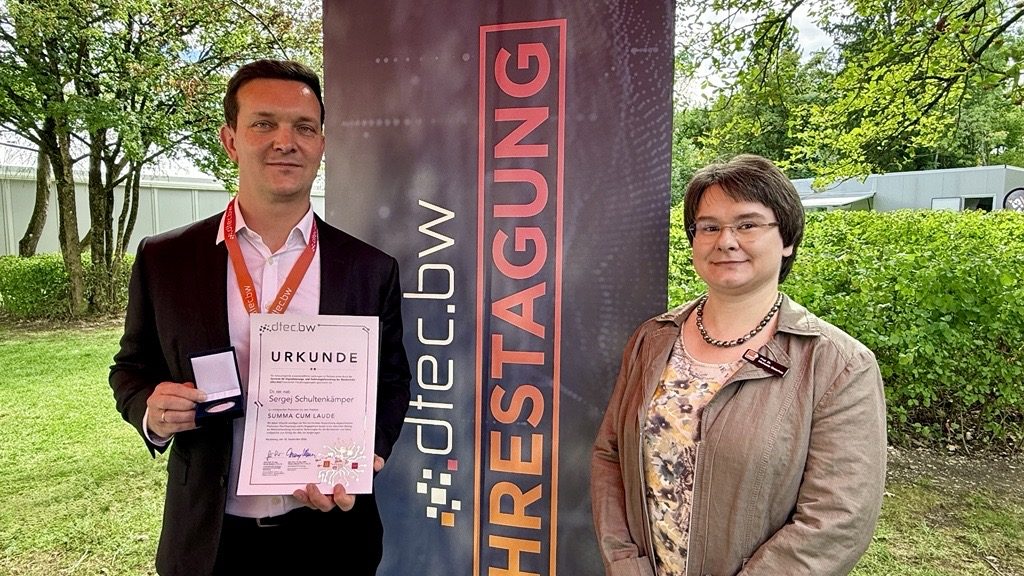 Sergej Schultenkämper with Prof. Dr. Michaela Geierhos at the dtec.bw annual conference 2026